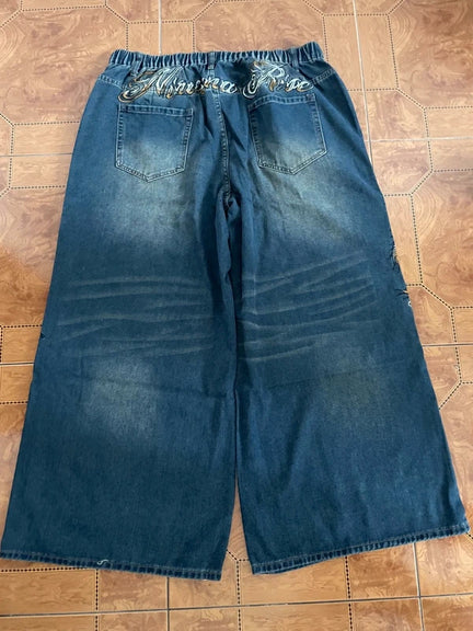 Szerokie baggy rap spodnie haft swag affliction opium